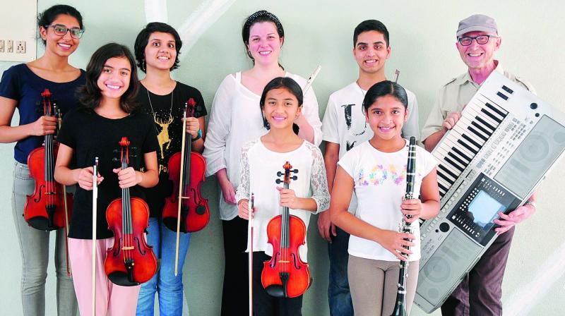 Joe Koster (extreme right) and Nicole Bhatia (top row, centre) along with young musicians during The Hyderabad Youth Ensemble