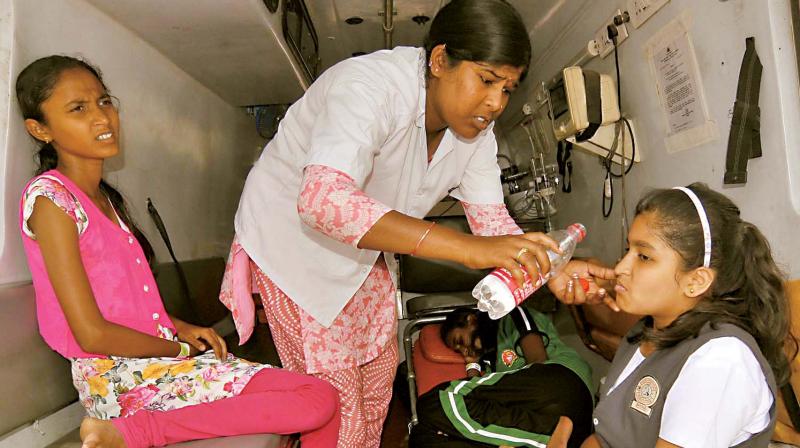 Students who fell ill during yoga rehearsal in Mysuru on Monday. (Photo: KPN)