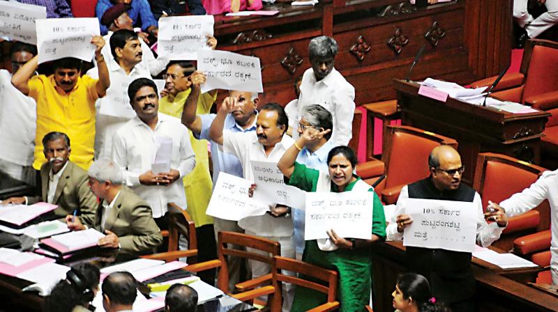 BJP MLCs protest during the Budget session of the state legislature at Vidhana Soudha in Bengaluru on Thursday  	 DC