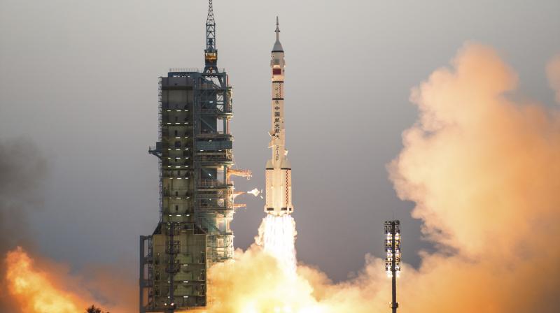 Chinas Shenzhou 11 spaceship onboard a Long March-2F carrier rocket takes off from the Jiuquan Satellite Launch Center in northwest Chinas Gansu province on Monday Oct. 17, 2016. China launched a pair of astronauts into space Monday on a mission to dock with an experimental space station and remain aboard for 30 days in preparation for the start of operations by a full-bore facility six years from now. (Photo: AP)