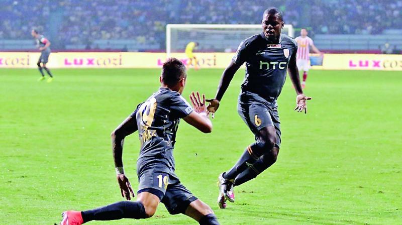 Northeast Uniteds Nicolas Velez and Romaric celebrate in their ISL-3 match against hosts Atletico de Kolkata on Thursday. The match ended 1-1.