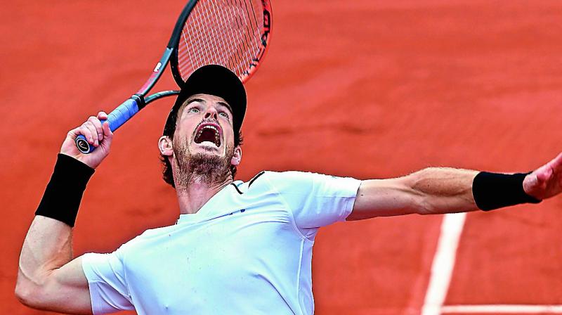 Britains Andy Murray serves to Karen Khachanov of Russia in their French Open fourth round match in Paris on Monday. Murray won 6-3, 6-4, 6-4.	(Photo: AFP)