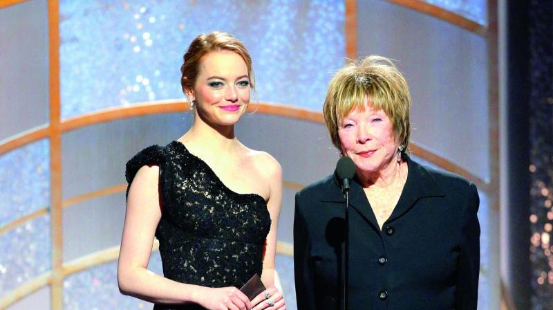 Emma had emerald green and white on her eyelids and violet on her lips. (Photo: DC)