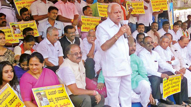 State BJP president B.S. Yeddyurappa speaks at a protest in Bengaluru on Monday seeking a probe by NIA into the murder of Deepak Rao in Mangaluru a few days ago 	 KPN