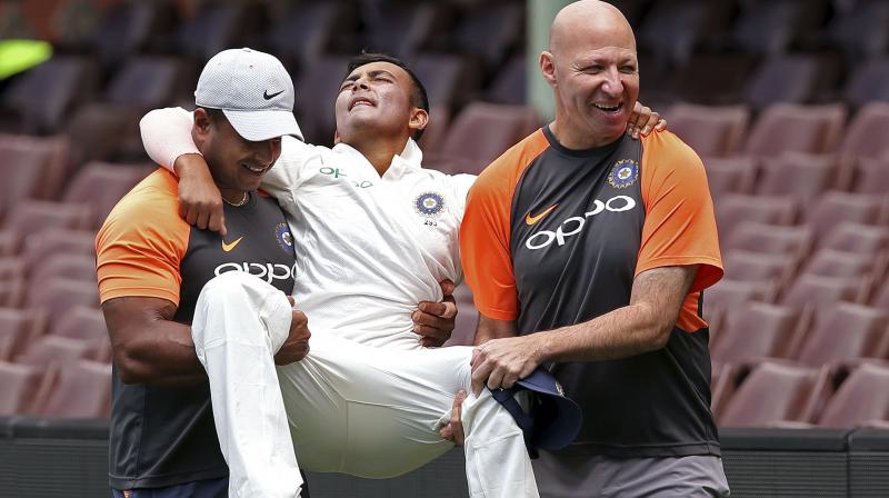 Indian opener Prithvi Shaw was carried off the field after landing on and rolling over his left ankle while fielding on day three of the tour game against Cricket Australia XI at the Sydney Cricket Ground on Friday. (Photo: AP)