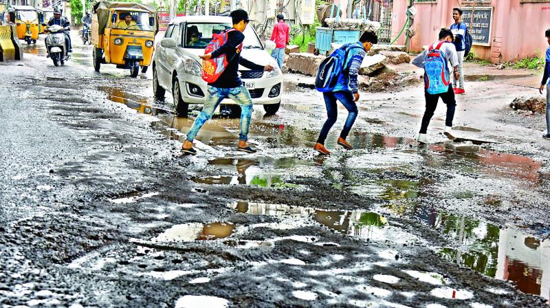Road on Narayanguda to Kacheguda stretch has been heavily damaged due to incessant rains in the city. (Photo: DC)