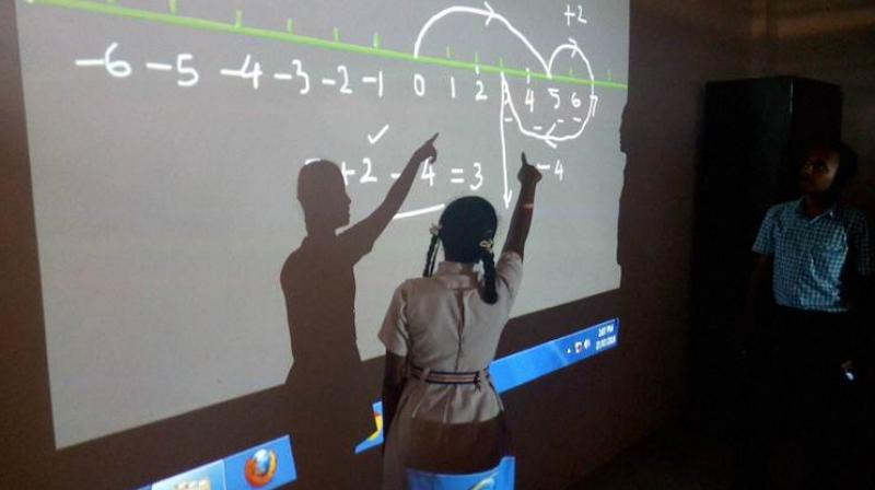 In Chhattisgarhs insurgency-hit Kanker district, children in over 100 government schools are learning basic maths through video lectures in Hindi. (Photo: PTI)