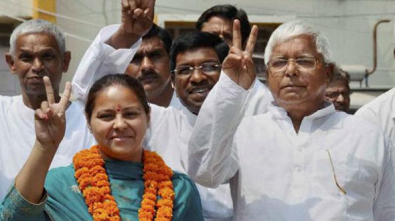 RJD chief Lalu Prasad along with his daughter and party candidate from Patliputra Misa Bharti. (Photo: PTI)