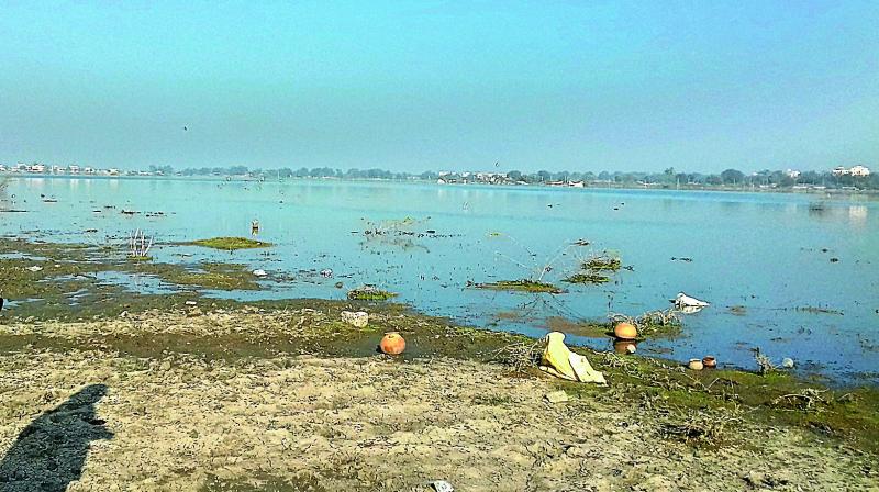 The lake shore has been littered and turned dirty with people throwing garbage including plastic bags and resorting to open defecation and consuming liquor.