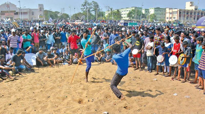 Silambattam enthusiasts perform during jallikattu protest in Marina on Sunday. (Photo: DC)