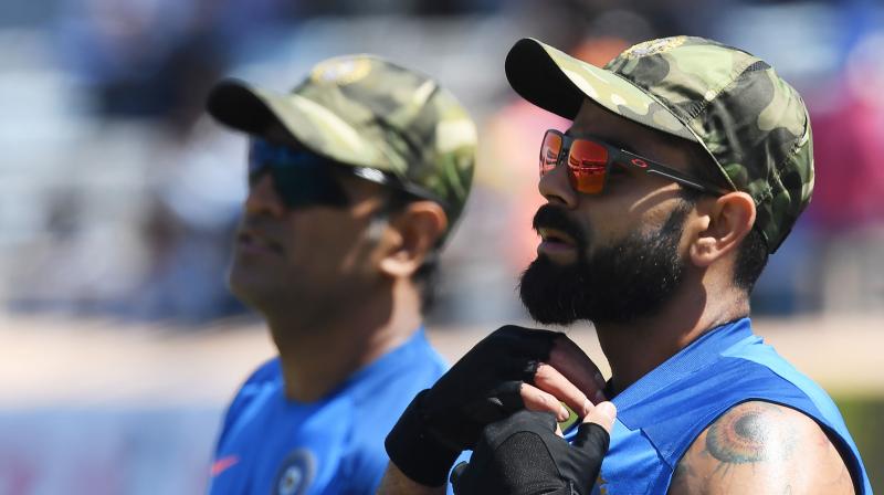 Former captain Bishan Singh Bedi tagged Mahendra Singh Dhoni as Indias \half a captain\ in the limited-overs and said his absence made Virat Kohli \visibly rough\ on the field during the fourth ODI against Australia. (Photo: AFP)