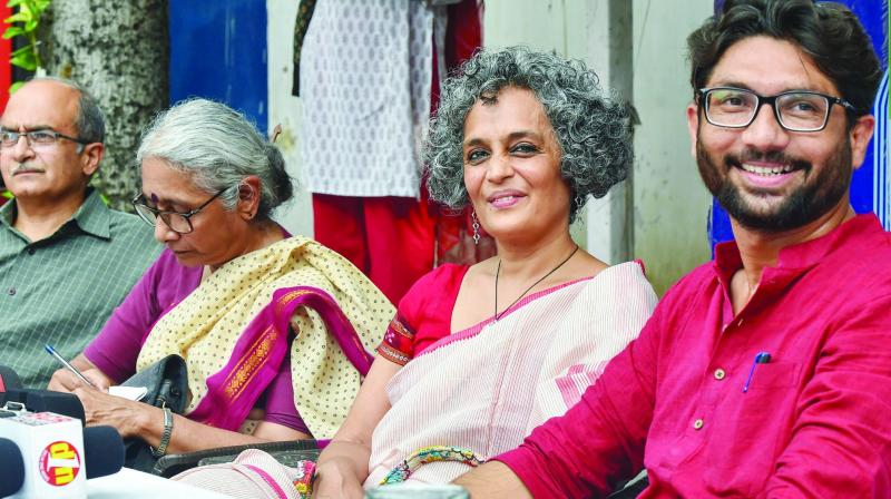 Arundhati Roy (2nd R), Gujarat MLA Jignesh Mewani (R), Aruna Roy (2nd L) and Prashant Bhushan at a press conference in New Delhi on Thursday. 	(Photo: PTI )