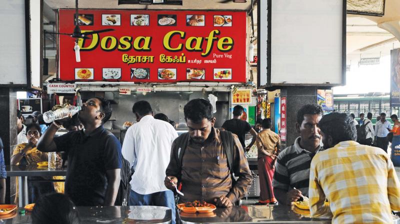 Passengers eating food at CMBT on Sunday.	(Photo: DC)
