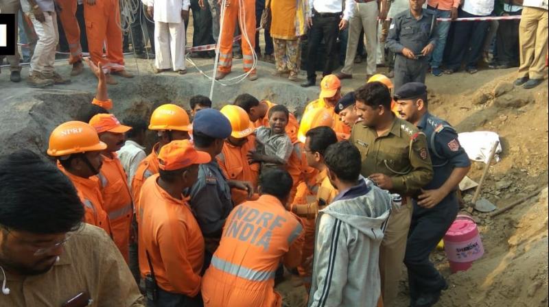 Ravi, son of a labourer working on road constructions, fell into the borewell while playing. (Photo: ANI/ Twitter)
