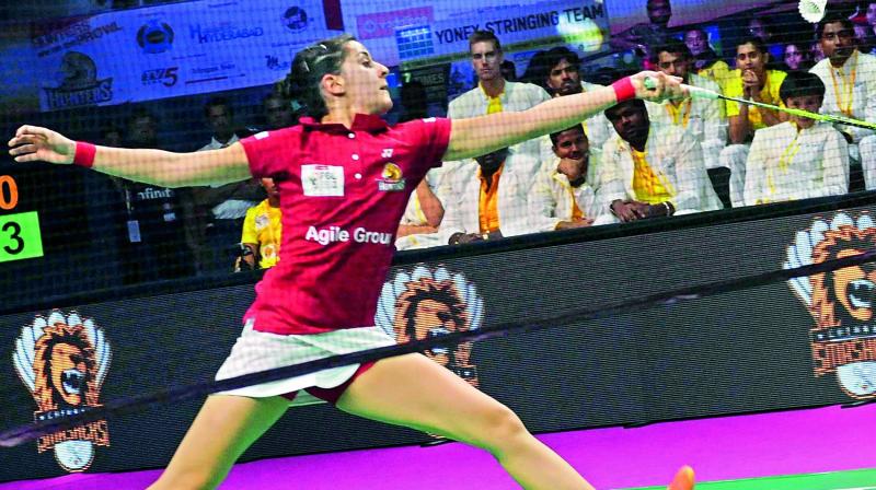 Carolina Marin stretches plays a shot during the first match of PBL 2 against P.V. Sindhu on Sunday at the Gachibowli Stadium in Hyderabad.(Photo: K. Surendra)