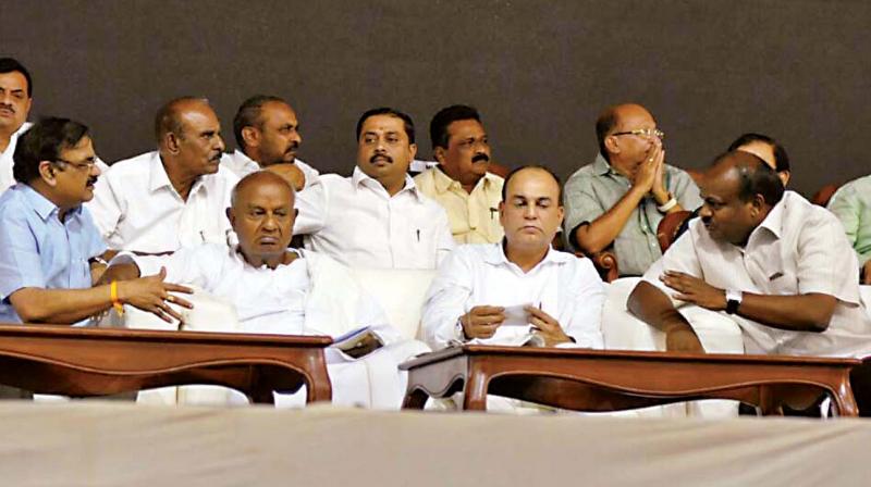 Former prime minister H.D. Deve Gowda, son and JD(S) state president H.D. Kumaraswamy and JD(S) national general secretary Danish Ali at the naming ceremony of the partys new office at Palace Grounds in Bengaluru on Thursday.