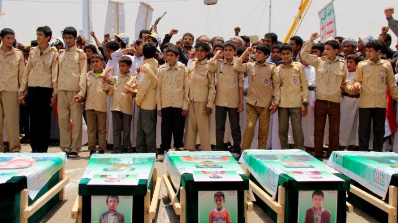 Yemeni children vent anger against Riyadh and Washington on August 13, 2018 as they take part in a mass funeral in the northern Yemeni city of Saada, a stronghold of the Iran-backed Huthi rebels, for children killed in an air strike by the Saudi-led coalition last week. (Photo: AFP)
