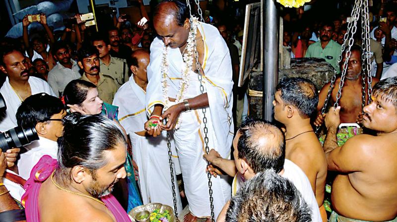 Chief Minister H.D. Kumaraswamy offers tulabhara at Kukke Subramanya temple on Tuesday  (Photo: KPN)