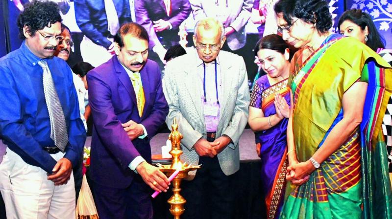 Vice-Chancellor of Andhra University Prof. G. Nageswara Rao lights the lamp to mark the inauguration of CME programme in Visakhapatnam on Sunday.