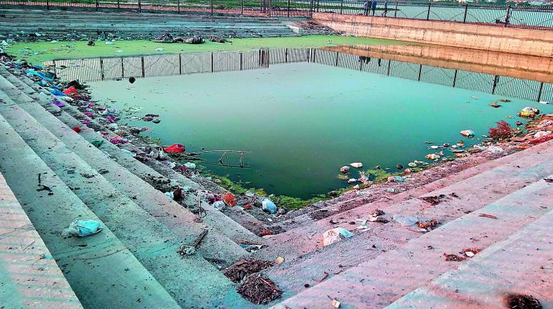 An artificial baby pond at Kapra being used as a dumping yard.