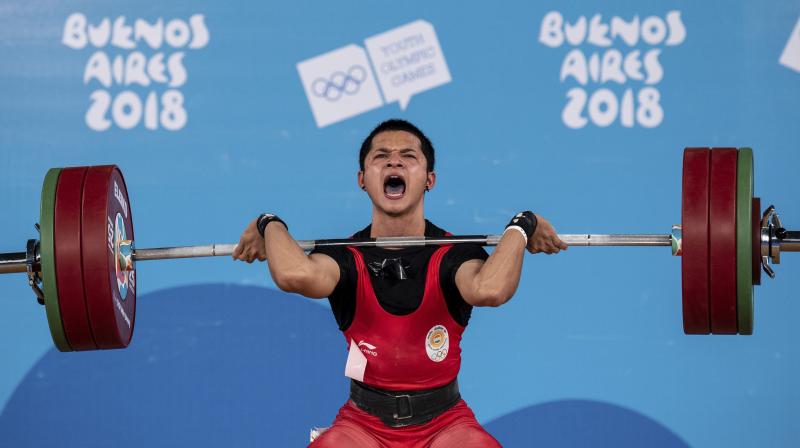 Son of a national-level boxer Lalneihtluanga, Lalrinnunga aspired to don the gloves too but shifted to weightlifting as it involved just power to excel, something he found fascinating. (Photo: AP)