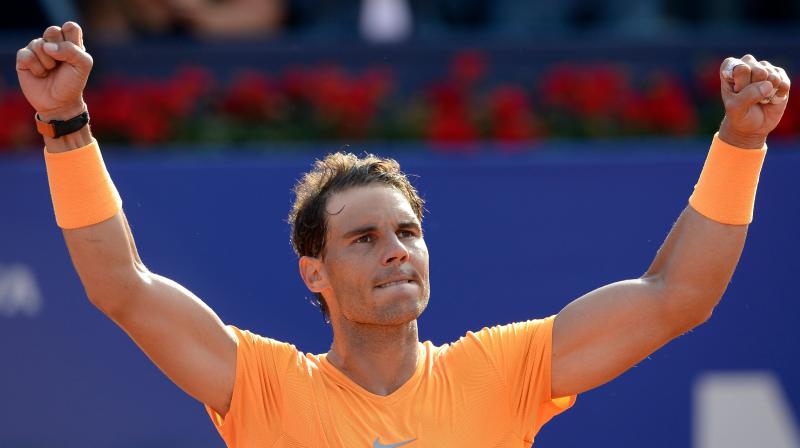 The 17-time Grand Slam champion, currently sidelined through injury, has also offered to open up his sports centre and tennis academy to people made homeless by the floods. (Photo: AFP)