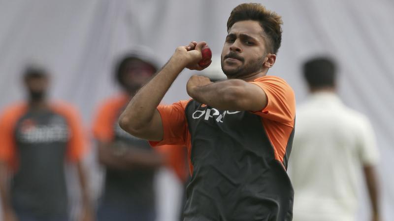 The pacer, who was handed over the Test cap by coach Ravi Shastri this morning, bowled just 1.4 overs before leaving the ground due to pain in the groin region. (Photo: AP)