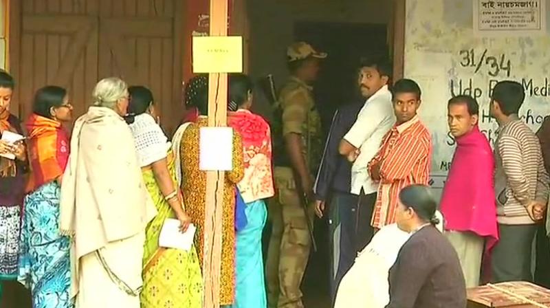 Voters queue up at polling booth number 31/34 in Tripuras Udaipur. (Photo: ANI/Twitter)