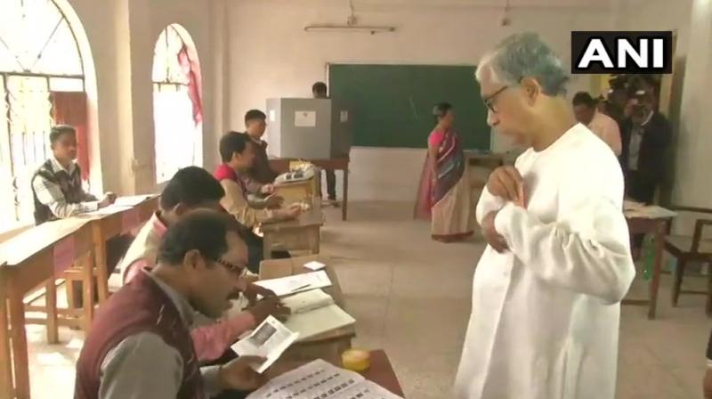 Tripura CM Manik Sarkar, an MLA from Dhanpur constituency casts his vote at a polling booth in Agartala. (Photo: ANI/Twitter)