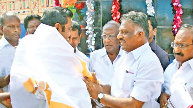 Deputy Chief Minister O. Panneerselvam welcomes Chief Minister Edappadi K. Palaniswami during MGR birth centenary celebrations in Theni district on Thursday. (Photo: DC)