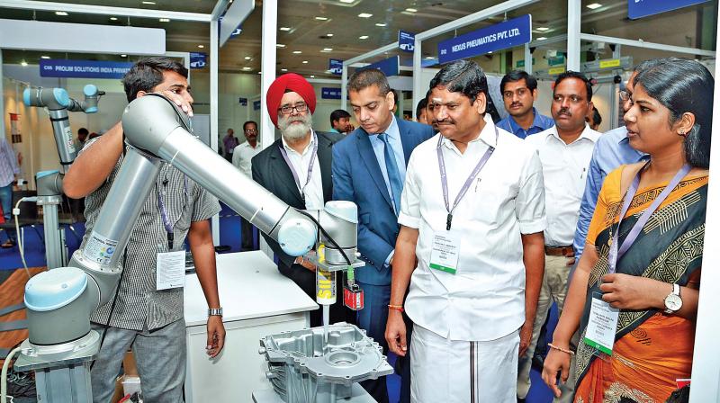 Industrial minister M.C. Sampath at the automotive  engineering show in city on Thursday. (Photo: DC)