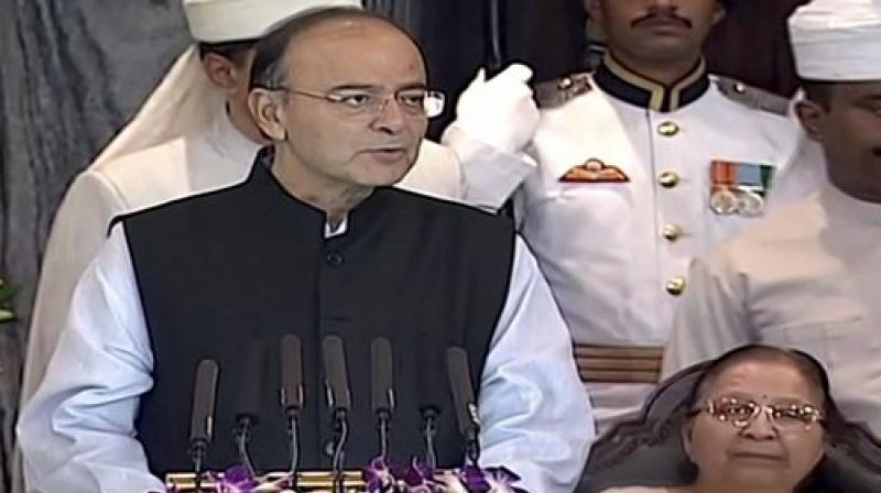 Finance Minister Arun Jaitley addresses the special session of Parliament for the launch of Goods and Services Tax (GST), in New Delhi on Friday. (Photo: PTI)
