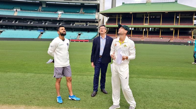 What took Twitterati by surprise was when Virat Kohli walked for the toss wearing shorts, whereas his rival captain Sam Whiteman was seen in the teams official kit. (Photo: Twitter / BCCI)