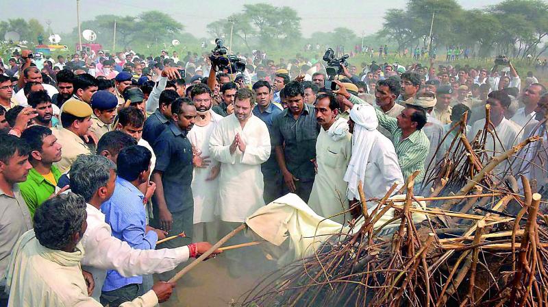 Congress vice-president Rahul Gandhi attends the cremation of veteran Ram Kishan Grewal at his village Bamla in Haryana on Thursday. (Photo: PTI)