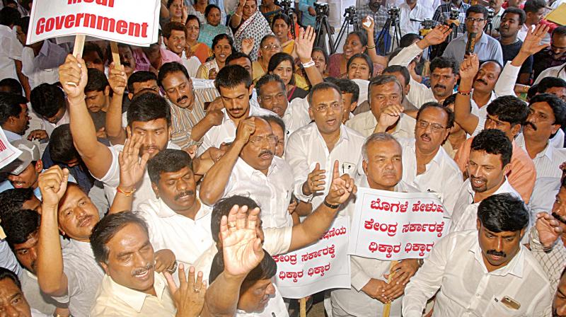 Congress workers protest against the arrest of party leader Rahul Gandhi, in Bengaluru on Thursday.