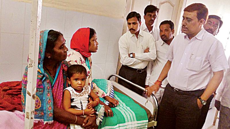 Surekha Deepak from Maharashtra (wearing red scarf), who gave birth on the road in Aurad a few days ago.