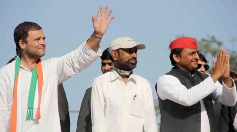 Congress vice-president Rahul Gandhi and Uttar Pradesh Chief Minister Akhilesh Yadav during a road show for Congress-SP alliance for the forthcoming UP Legislative Assembly election, in Allahabad. (Photo: PTI)