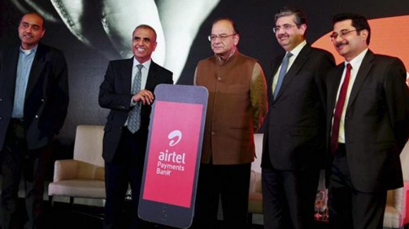 Union Finance Minister Arun Jaitley with Bharti Enterprises Chairman Sunil Bharti Mittal and Kotak Mahindra Bank, Executive VC, Uday Kotak during the launch of Airtel Payments Bank in New Delhi on Thursday. (Photo: PTI)