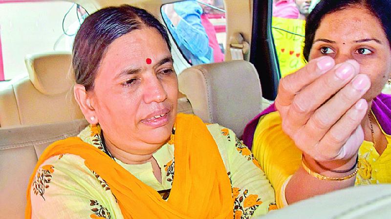 Activist Sudha Bharadwaj being arrested from her  residence in Haryanas Faridabad, Saturday. (Photo: AP0