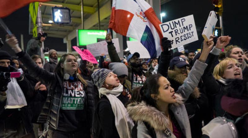 Protesters block an intersection near Terminal 4 at John F. Kennedy International Airport in New York, Saturday, Jan. 28, 2017, after earlier in the day two Iraqi refugees were detained while trying to enter the country. (Photo: AP)