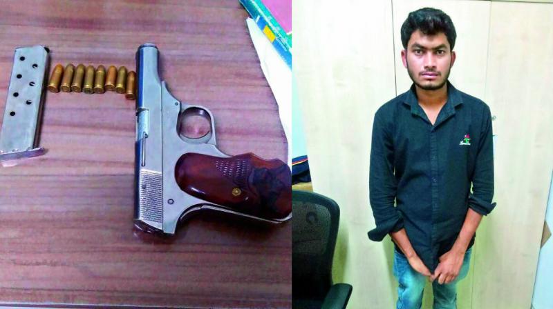 Satish Kumar and the pistol recovered from him. 	 DC
