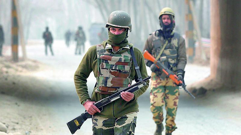 Soldiers patrol near the site of a encounter at Arwani in Kashmir on Thursday. (Photo: AP)