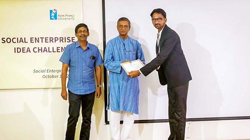 Jitendra Singh (extreme-right) receiving the first prize at the National Social Enterprise Idea Challenge held at Azim Premji University in Bengaluru