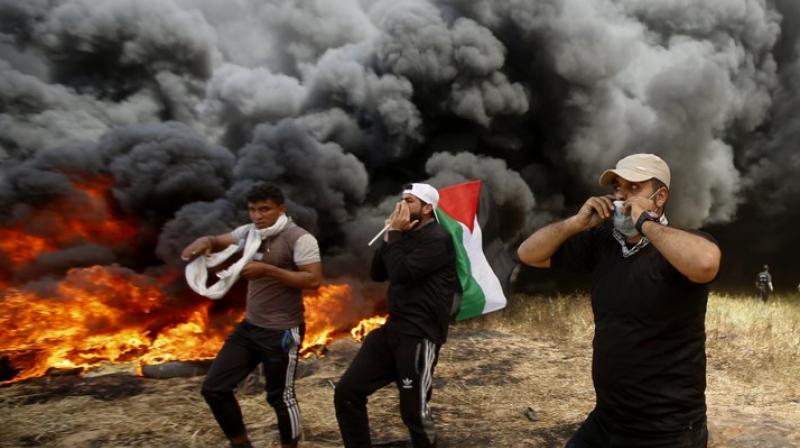 Israeli fire kills nine, hundreds hurt in Gaza border protest