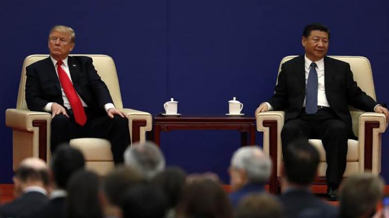 While President Donald Trump faces continuing churn in his administration and a tough challenge in midterm congressional elections, Chinas Xi Jinping leads an outwardly stable authoritarian regime. (Photo: AP)