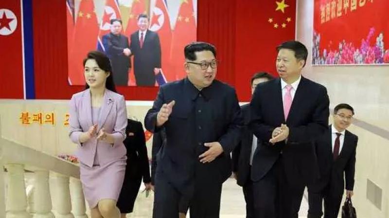 Dressed in a dusty pink two-piece skirt suit, Ri was accompanied by senior North Korean officials often seen with the leader, including Kims younger sister, Yo Jong. (Photo: AFP)