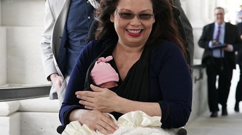 US senator Tammy Duckworth arrives at the US Capitol with her newborn baby daughter Maile Pearl Bowlsbey for a vote on the Senate floor on Capitol Hill in Washington. (Photo: AFP)