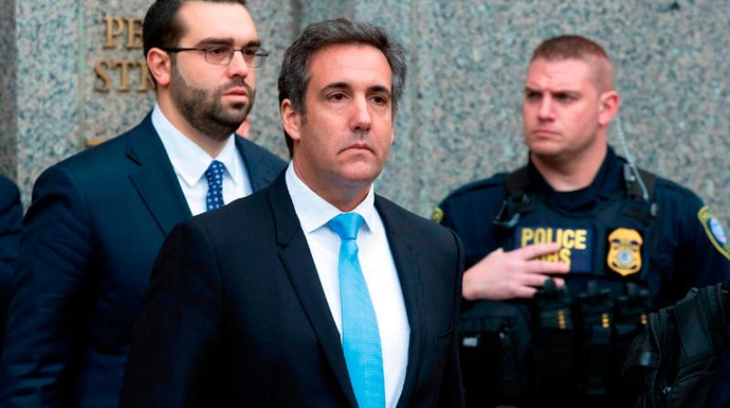 Prosecutors have said theyre investigating Cohens (C) personal business dealings but havent said what crime they believe he may have committed. (Photo: AP)