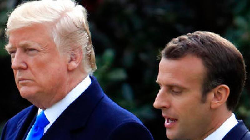 Waiting at the door, the US president smiled and held out his hand for Macron to shake, and the French leader kissed him on both cheeks. (Photo: AP)