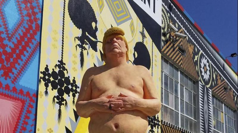The infamous statue by a West Coast anarchist collective is one of a series depicting the 45th president in the nude, but without testicles. (Photo: AP)